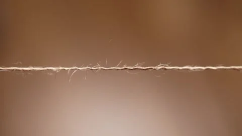 Thin stretched brown jute twine string Video stock 336548938