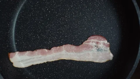 Thin Striped Bacon Fries On A Pan 動画素材 122172756
