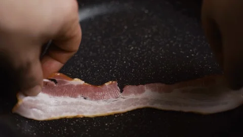 Thin Striped Bacon Fries On A Pan Vidéo 122174907