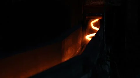 A thin thread of hot steel, like a snake crawling through the tunnel. Metal Stock-Footage 101781697
