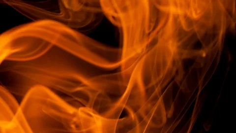 Thin trickle of fiery orange-red smoke rising graceful twists up Stock Footage 105146935
