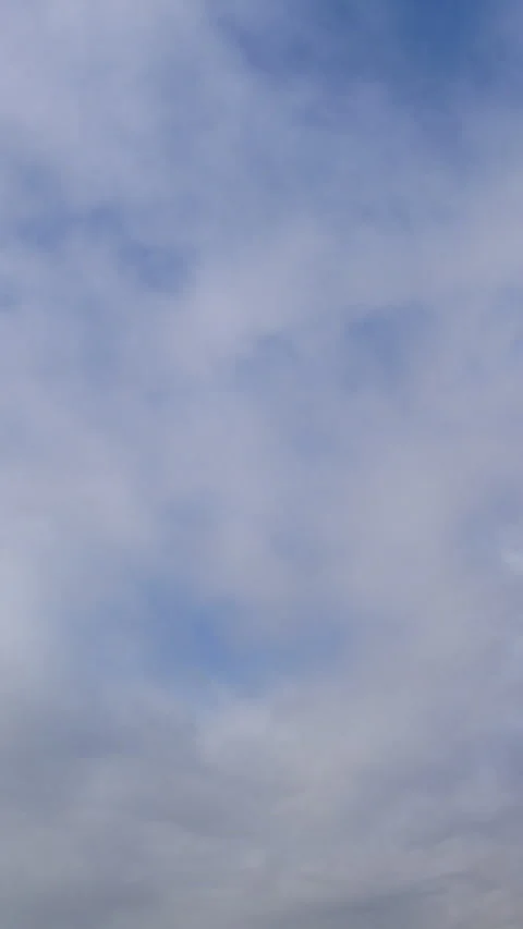Thin Veil of Clouds Over Pale Blue Sky Time Lapse Vertical Video 库存影片 345937863