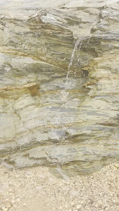Thin Water Stream Flowing Down Natural Rock Wall Video stock 330266639