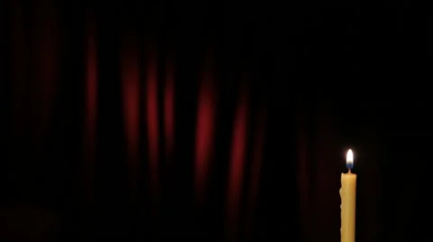 Thin wax candle is lit and burning Stock Footage 46953535