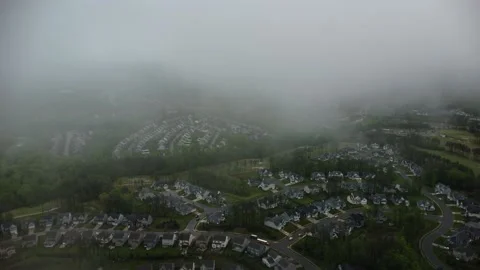 Thin whispy clouds over neighborhood Video stock 239938957
