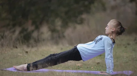 Thin woman doing yoga exercise Stock Footage 56286135
