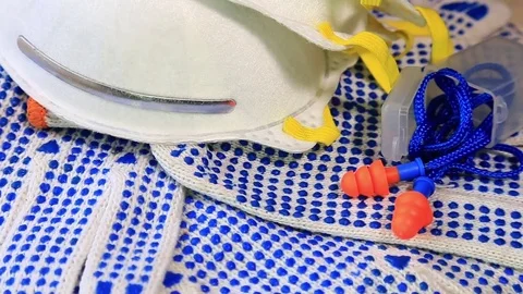 Thin work gloves with blue pimples, respirators and ear plugs Stock Footage 70826211