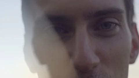 A thin young guy stands at sunset Stockbeeldmateriaal 156001955