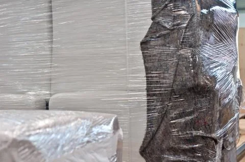 Things are packed in a transparent protective film Stock Photos