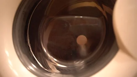 Things are washed in the washing machine. Drum washing machine. Housework Video stock 157365172