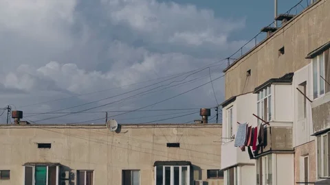 Things dry outside the balcony in a multi-story building Stock Footage 126887782