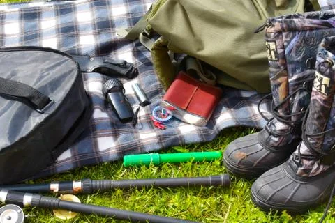 Things hunter on the grass. A necessary set of items for natural extreme travel. Stock Photos