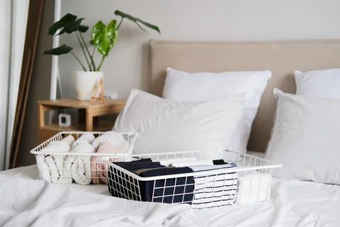 Things in mesh storage containers. Vertical storage of clothing. Sorting clothes Stock Photos