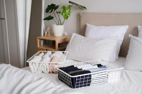 Things in mesh storage containers. Vertical storage of clothing. Sorting clothes Stock Photos