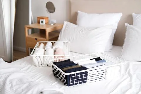 Things in mesh storage containers. Vertical storage of clothing. Sorting clothes Stock Photos