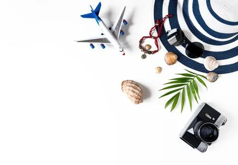 Things for summer holidays: a camera, shells, an airplane, sunglasses, a hat, a Stock Photos