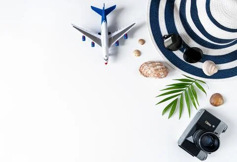 Things for summer holidays: a camera, shells, an airplane, sunglasses, a hat, a Stock Photos