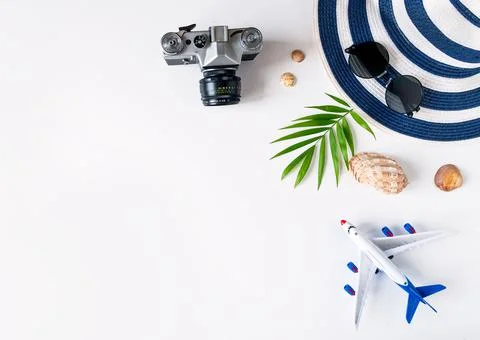 Things for summer holidays: a camera, shells, an airplane, sunglasses, a hat, a Stock Photos