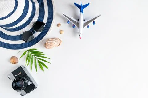 Things for summer holidays: a camera, shells, an airplane, sunglasses, a hat, Stock Photos