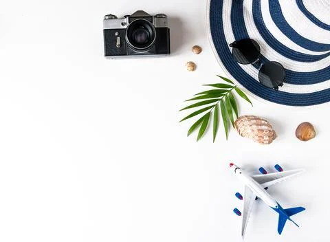 Things for summer holidays: a camera, shells, an airplane, sunglasses, a hat, Stock Photos