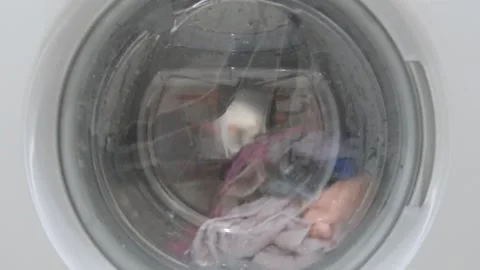 Things washed in spinning drum of washing machine 스톡 동영상 284252744