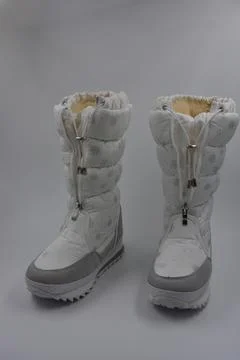 Things, winter women's boots with silver snowflakes, gray leather inserts. Stock Photos