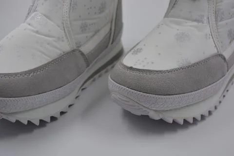 Things, winter women's boots with silver snowflakes, gray leather inserts. Stock Photos