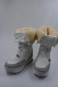 Things, winter women's boots with silver snowflakes, gray leather inserts. Stock Photos
