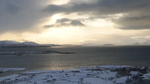 Thingvallavatn lake with reflection of sun during winter near sunset Stock Footage 93487516