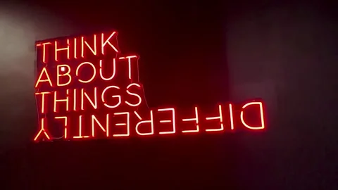 Think About Things Differently Red Neon Sign on oblique angle Stock Footage 280161006