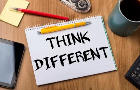 THINK DIFFERENT - Note Pad With Text On Wooden Table Stock Photos