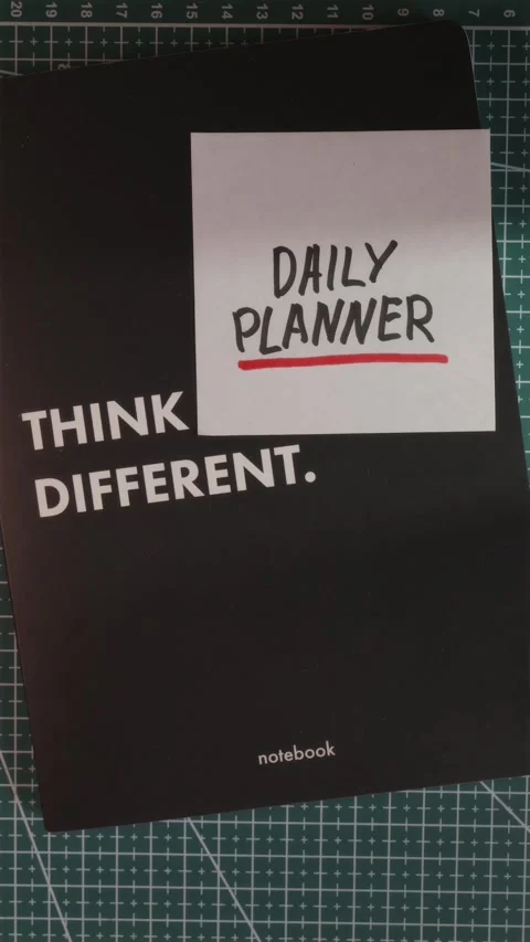 Think Different notebook with Daily Planner note flat lay Stock Footage 341246045