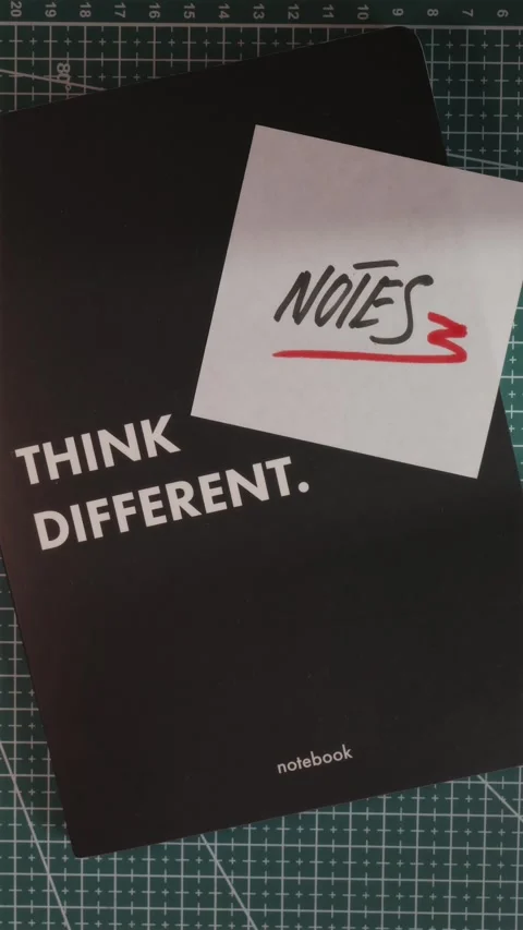Think Different notebook with Notes paper note flat lay Stock Footage 341246023