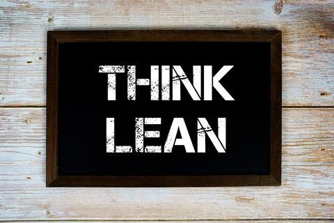 Think Learn text written on blackboard flat lay on wooden background Stock Photos
