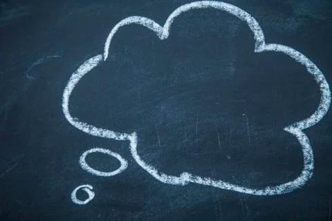 Think or speech bubble on a blackboard Stock Photos