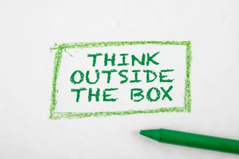 THINK OUTSIDE THE BOX concept. Text on a white page Stock Photos
