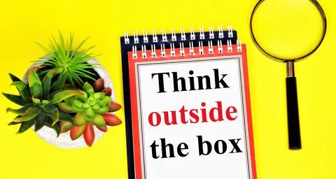 Think outside the box. A text label in the research notebook. Stock Photos
