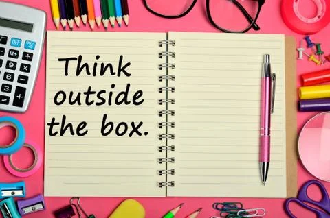 Think outside the box words on notebook 스톡 사진