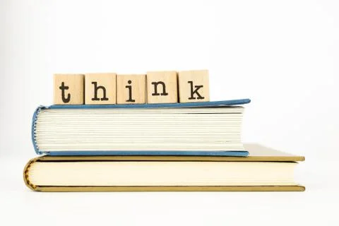 Think wording stack on books Stock Photos