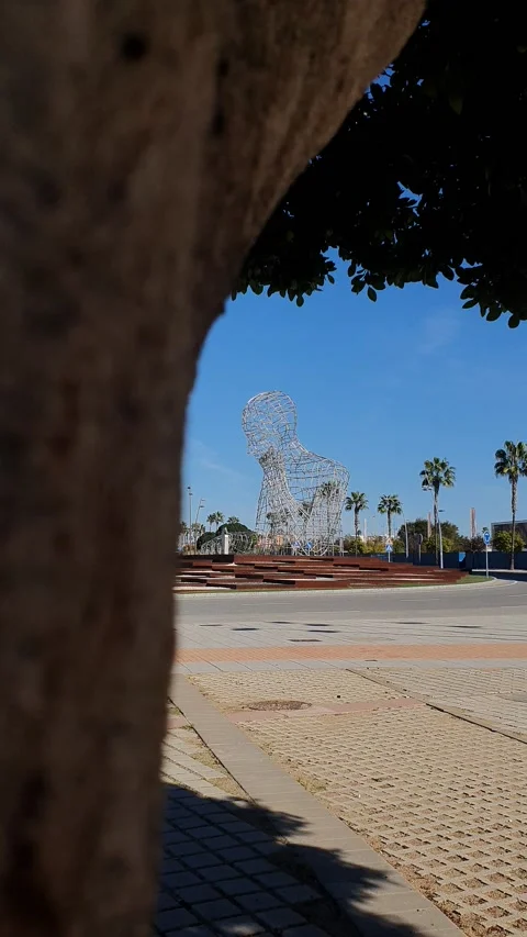 The thinker's monument in Dos Hermanas with palm trees Stock Footage 224869555