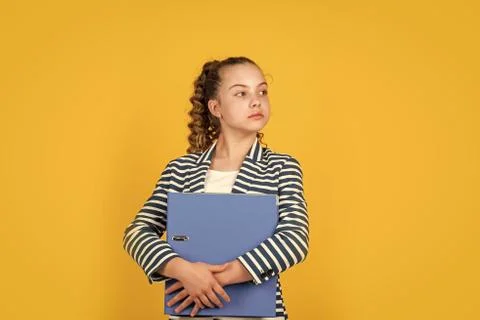 Thinking about problems. kid with curly hair wear jacket. work with documents Stock Photos