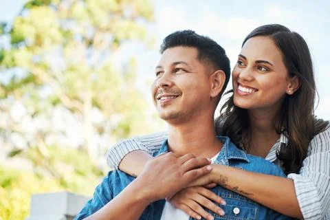 Thinking about their future. an affectionate young couple looking thoughtful Stock Photos