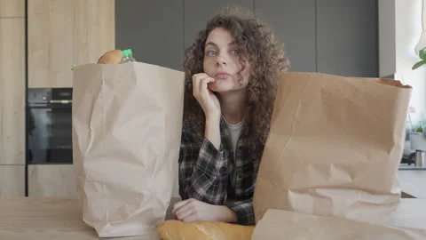 Thinking About What To Cook After Shopping, Then Snaps Fingers With Idea Stock Footage 311277427