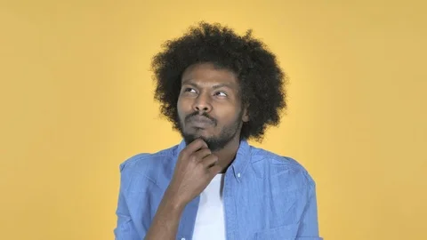 Thinking Afro-American Man with New Plan on Yellow Background Stock Footage 99220626