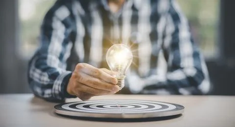 Thinking and creative concept, Close up the light bulb and working on the des Stock Photos