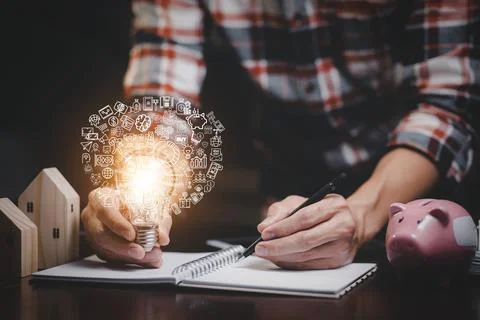 Thinking and creative concept, Close up light bulb and working on the desk, C Stock Photos