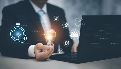 Thinking and creative concept, Close up the light bulb and woman working on t Stock Photos