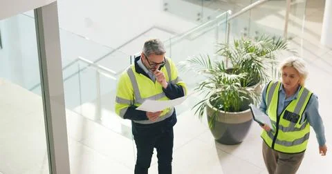 Thinking, architect and man with blueprint for office renovation, construct.. Foto stock