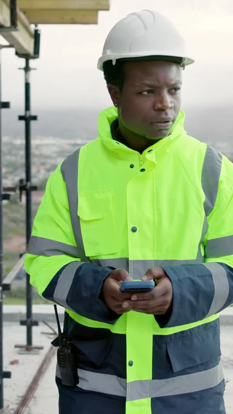 Thinking, architect and man with phone on construction site, texting and Video stock 338010401
