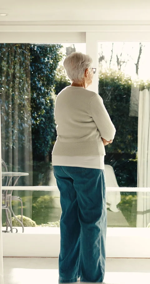 Thinking, back and old woman at window with nostalgia, daydreaming or flashback Stock Footage 342230531